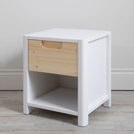 Should I choose a natural wood or white house bed for my nursery?