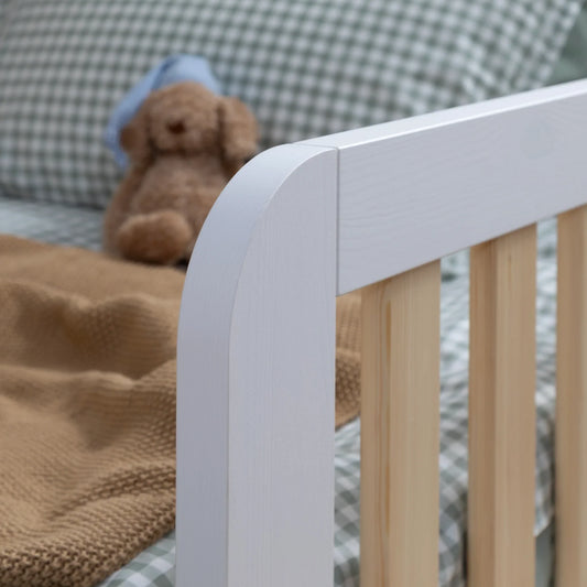 When is the right time to move a toddler from a cot to their own bed?