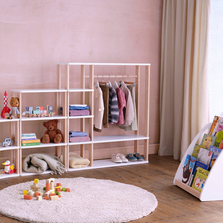 Round wooden shelf unit from Roomix Montessori wardrobe showcasing practical storage and minimalist design